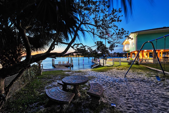 yard at dusk with a water view