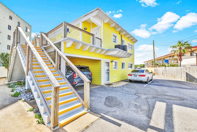 view of front of home featuring a balcony