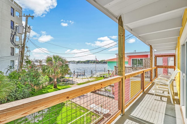 balcony featuring a water view