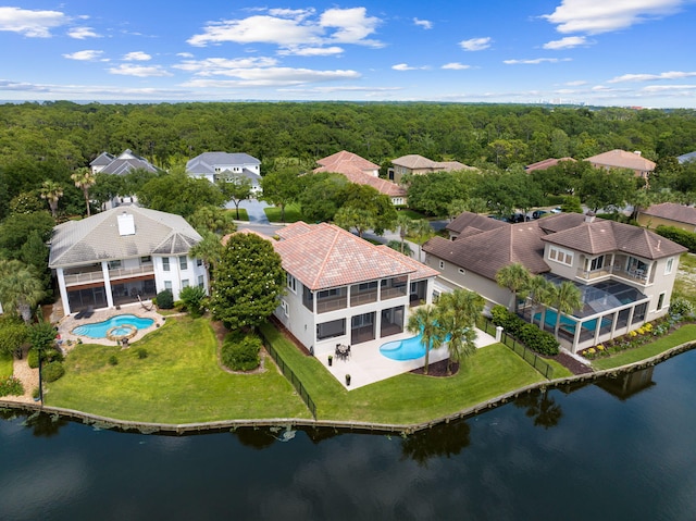 birds eye view of property with a water view