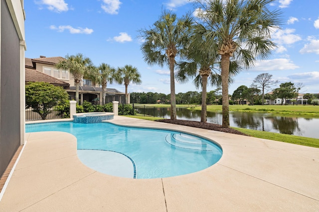 view of swimming pool with an in ground hot tub, a patio, and a water view