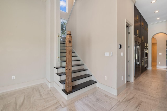 stairway with parquet flooring