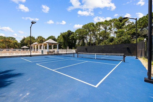 view of tennis court with a gazebo