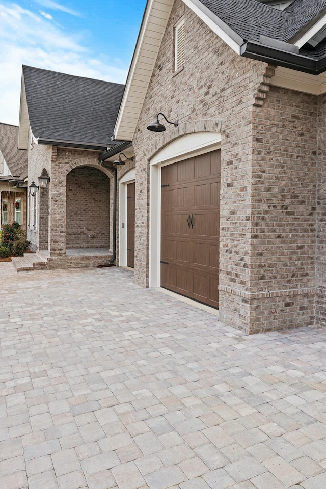 view of side of home with a garage