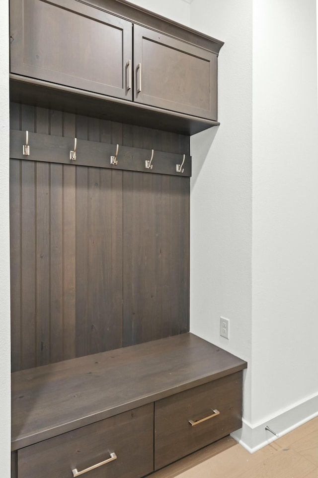 mudroom with light hardwood / wood-style flooring