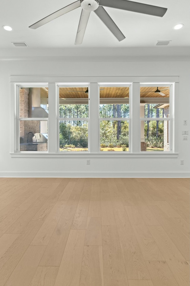 spare room featuring light hardwood / wood-style floors