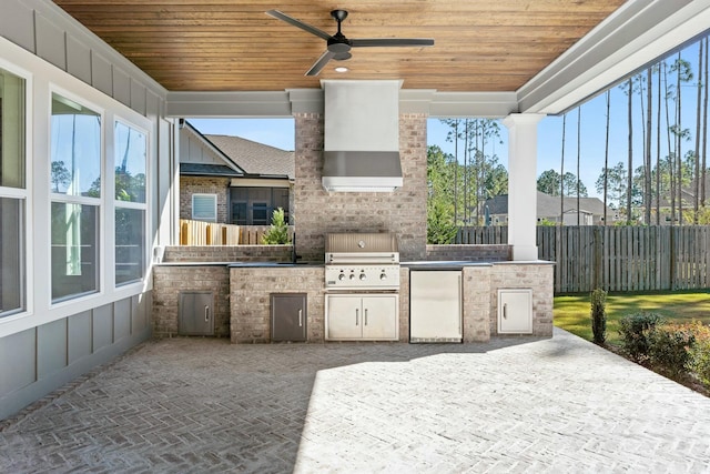 view of patio with area for grilling, a grill, sink, and ceiling fan