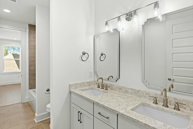 full bathroom featuring tile patterned flooring, vanity, toilet, and tub / shower combination