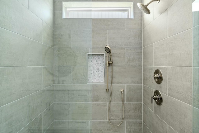 bathroom with tiled shower