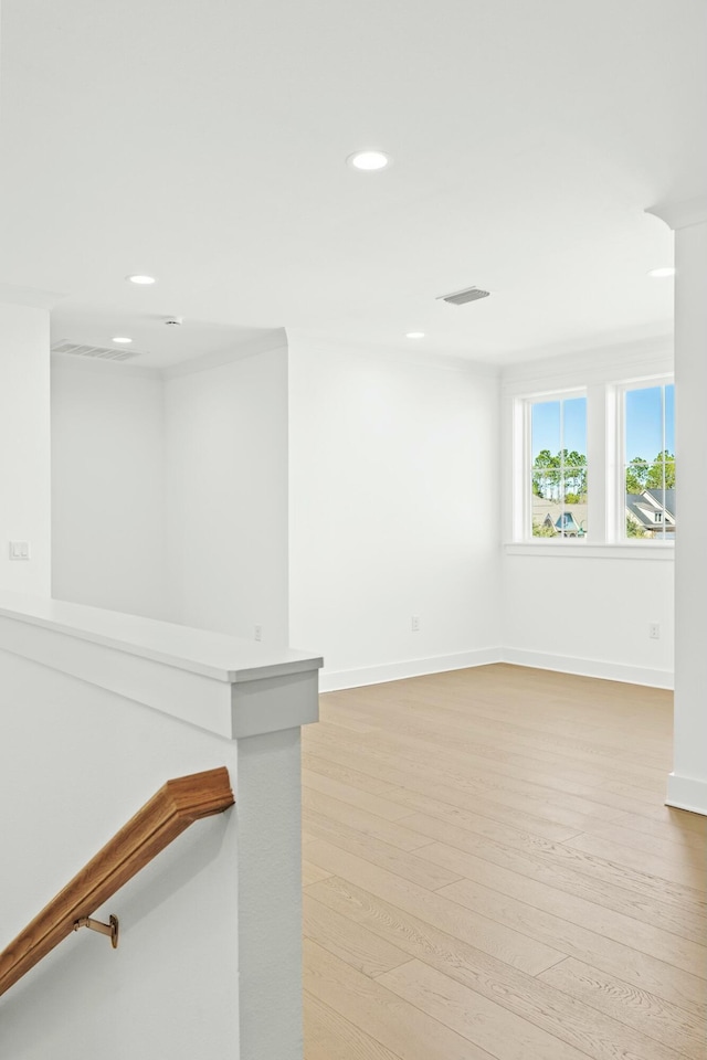 unfurnished room with light wood-type flooring