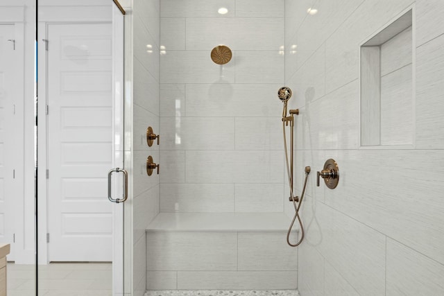 bathroom with a shower with shower door