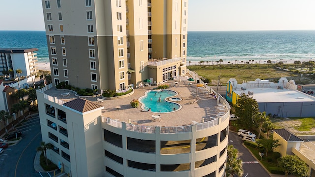 birds eye view of property featuring a water view and a view of the beach