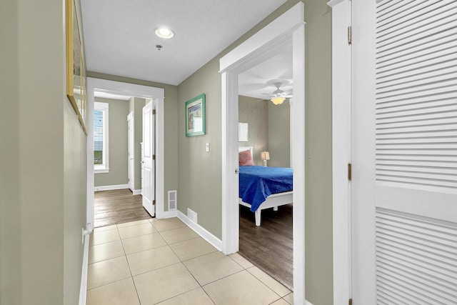 hallway featuring light tile patterned floors