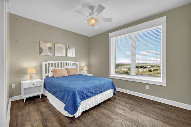 bedroom featuring dark wood-type flooring and ceiling fan