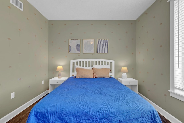 bedroom featuring dark hardwood / wood-style floors