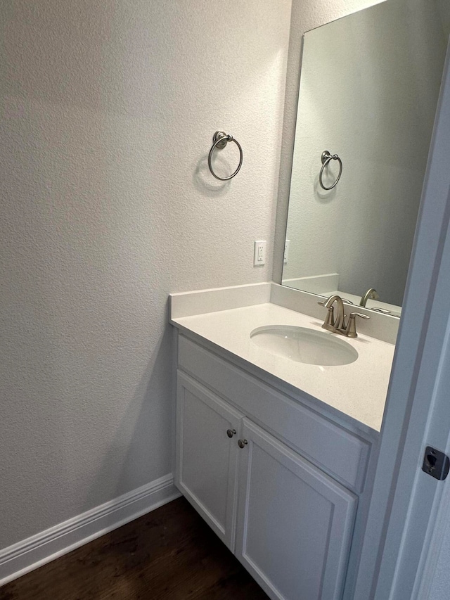 bathroom featuring vanity and wood-type flooring