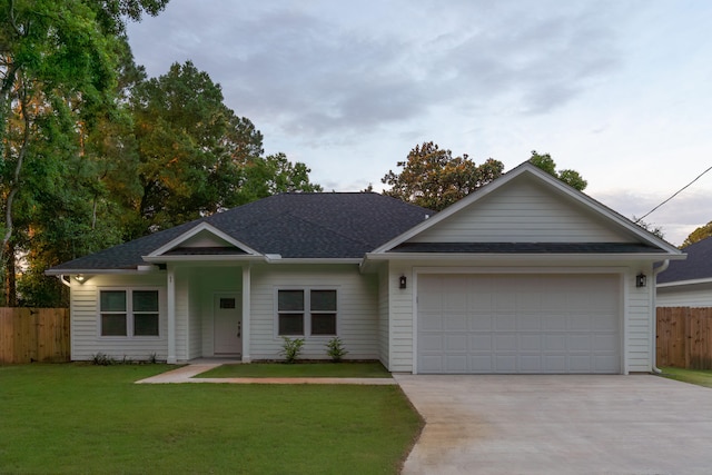 single story home with a garage and a front yard