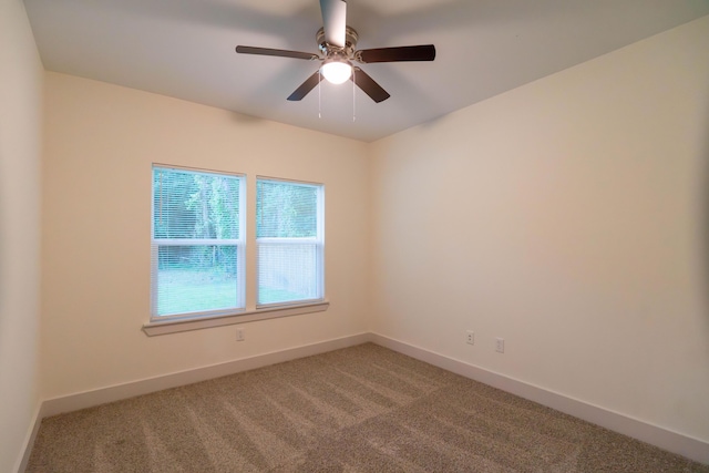 empty room featuring carpet and ceiling fan