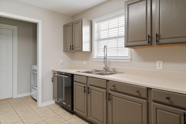 kitchen featuring dishwasher, light tile patterned floors, gray cabinetry, and sink