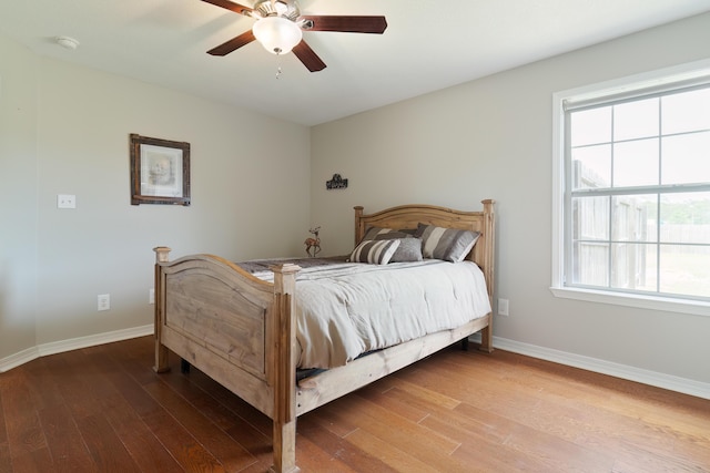 bedroom featuring hardwood / wood-style floors and ceiling fan