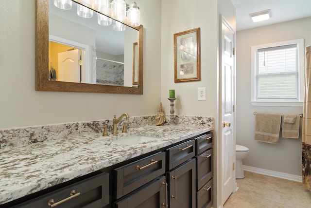 bathroom featuring tile patterned flooring, vanity, toilet, and a shower with curtain