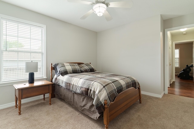 carpeted bedroom featuring ceiling fan