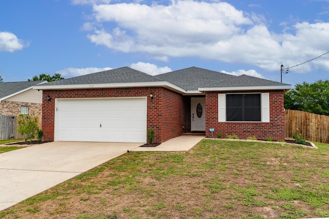 single story home with a front yard and a garage