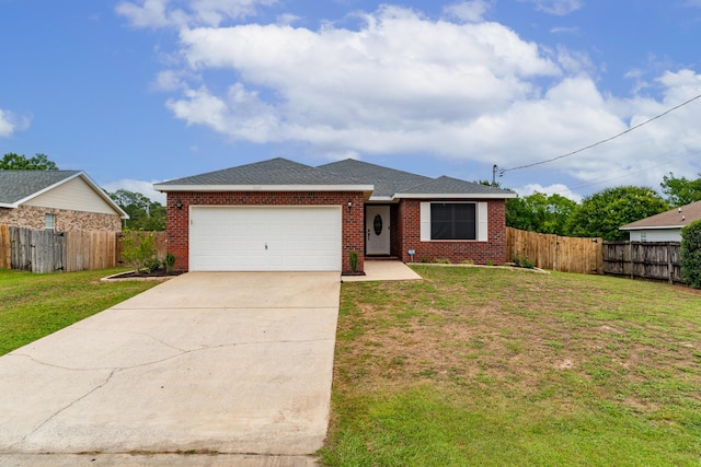 view of front of home with a garage and a front lawn