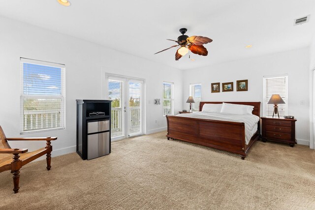 carpeted bedroom featuring access to outside and ceiling fan