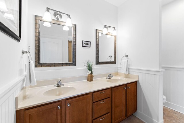 bathroom with toilet and vanity