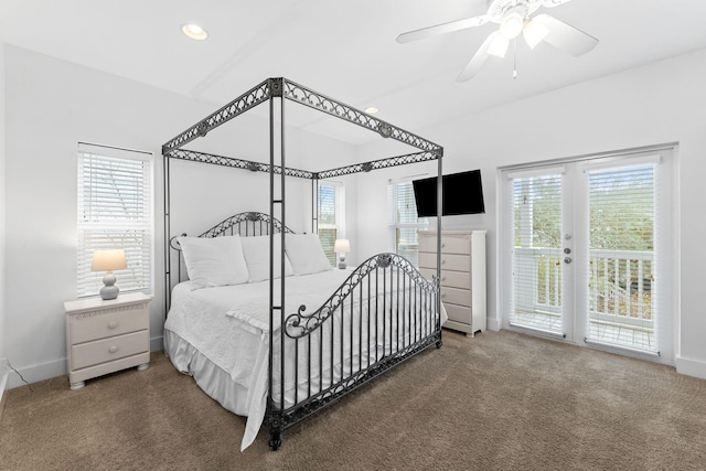 bedroom featuring ceiling fan, multiple windows, carpet, and access to exterior