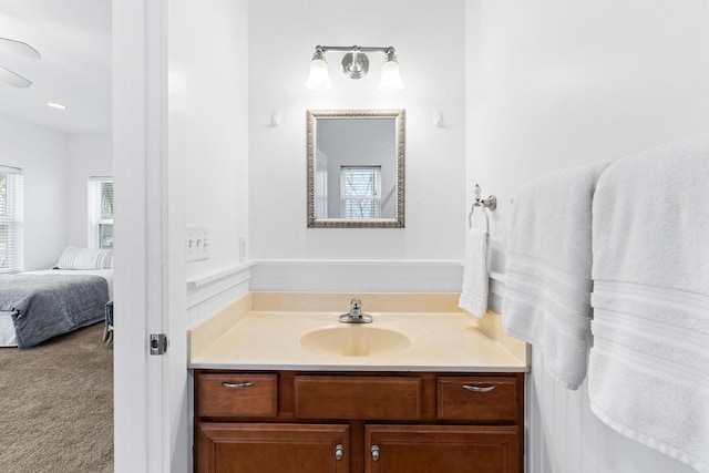 bathroom featuring vanity and ceiling fan