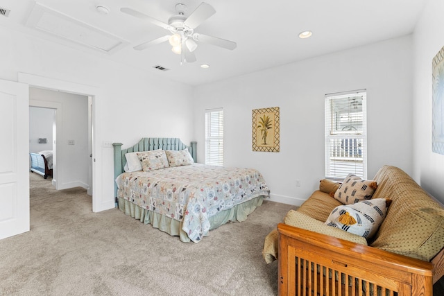 bedroom featuring ceiling fan and light carpet