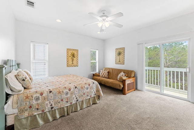 bedroom featuring ceiling fan, carpet, multiple windows, and access to exterior