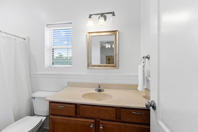 bathroom with toilet and vanity