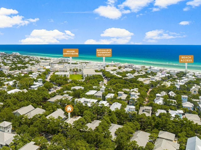 birds eye view of property with a beach view and a water view