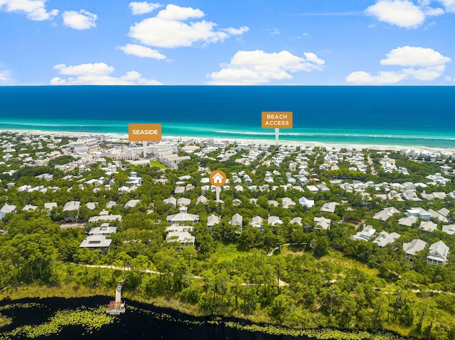 bird's eye view featuring a beach view and a water view