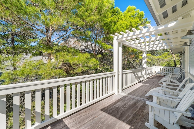 wooden deck featuring a pergola