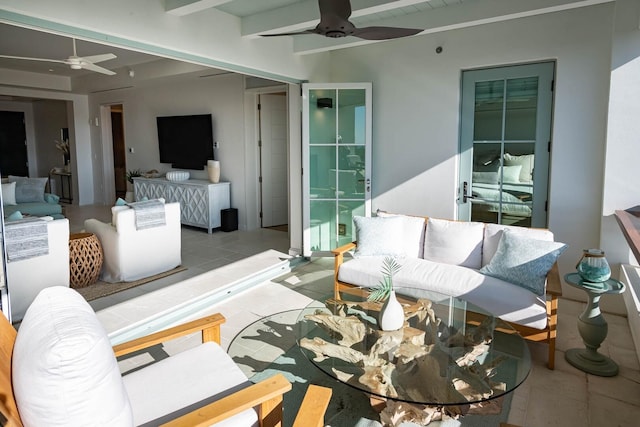 living room featuring tile flooring and ceiling fan