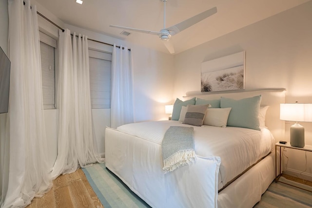 bedroom featuring wood-type flooring and ceiling fan