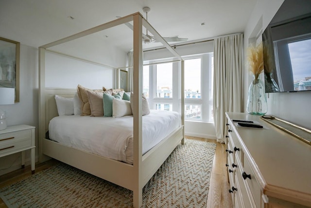 bedroom with wood-type flooring