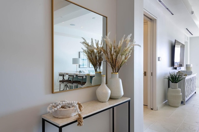 hallway with light tile floors