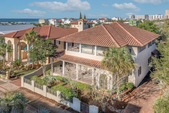 birds eye view of property with a water view