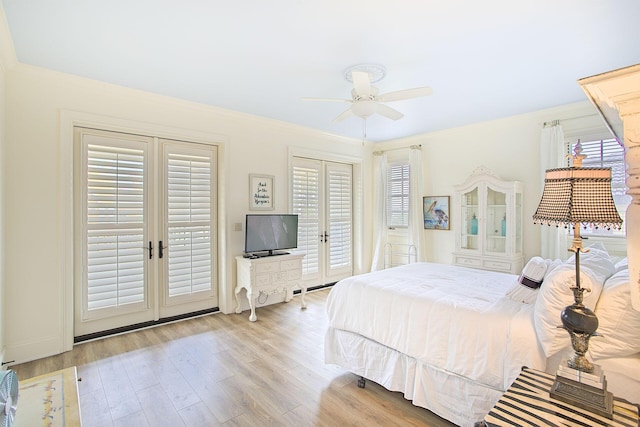 bedroom with ceiling fan, light wood-type flooring, access to outside, and french doors