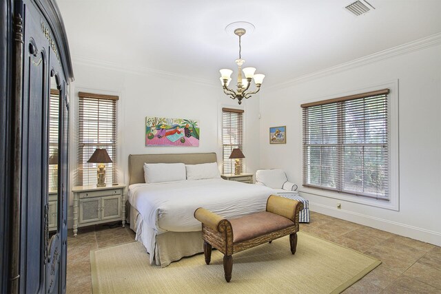 bedroom featuring an inviting chandelier and crown molding