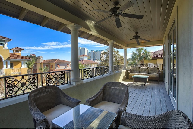 deck with ceiling fan and outdoor lounge area