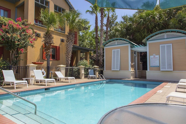 view of swimming pool with a patio