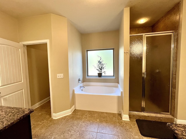 bathroom featuring vanity, tile patterned flooring, and independent shower and bath