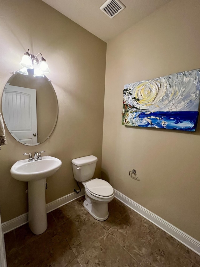 bathroom with sink and toilet