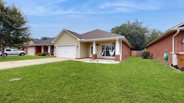 view of front of property with a garage and a front lawn